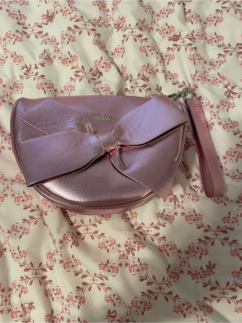 NWOT Metallic Pink Bow Wristlet Clutch